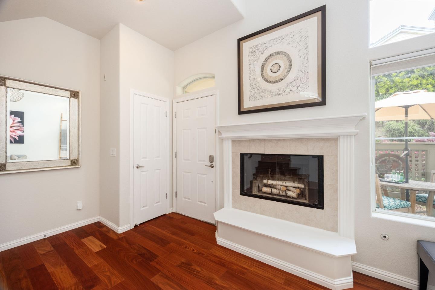 12 Patrick Way Half Moon Bay, CA 94019 - Photo 7 of 36 a view of a hallway with wooden floor and a fireplace