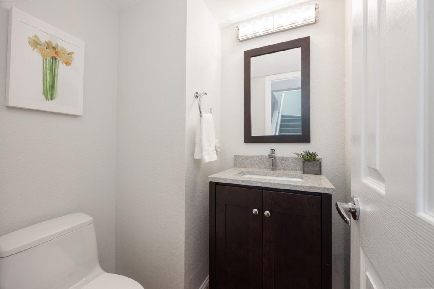 12 Patrick Way Half Moon Bay, CA 94019 - Photo 9 of 36 a bathroom with a toilet a sink and mirror