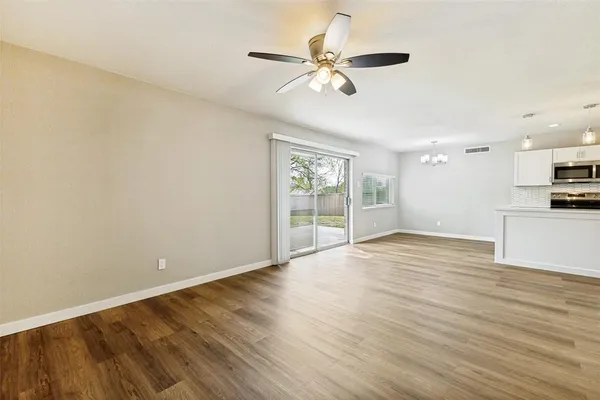 a view of kitchen with wooden floor