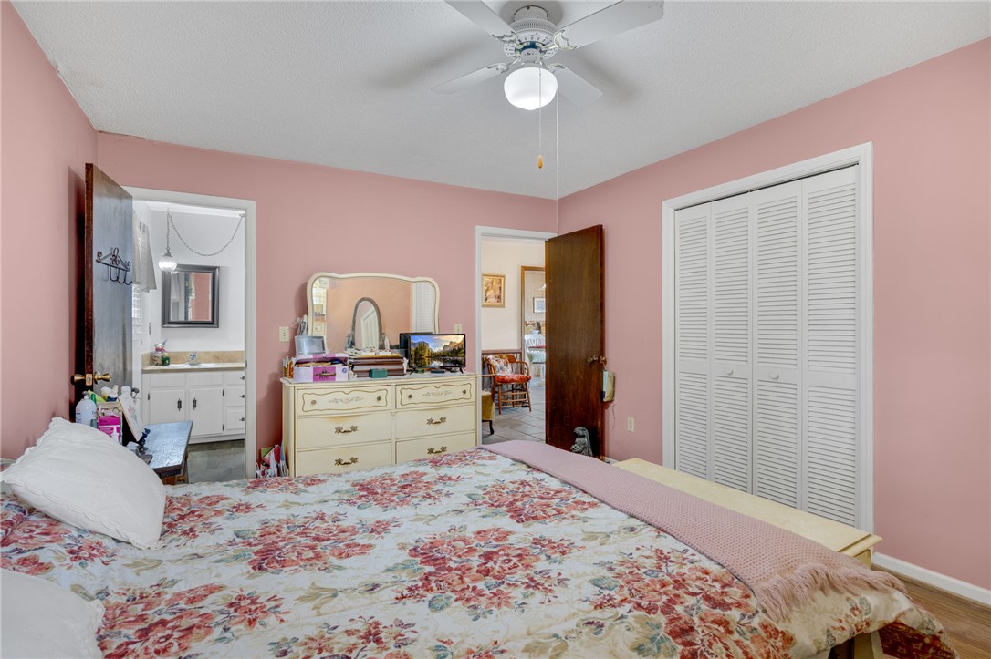 131 Bowen Road Anderson, SC 29621 - Photo 17 of 36 A spacious bedroom offers direct access to an adjacent private bathroom.