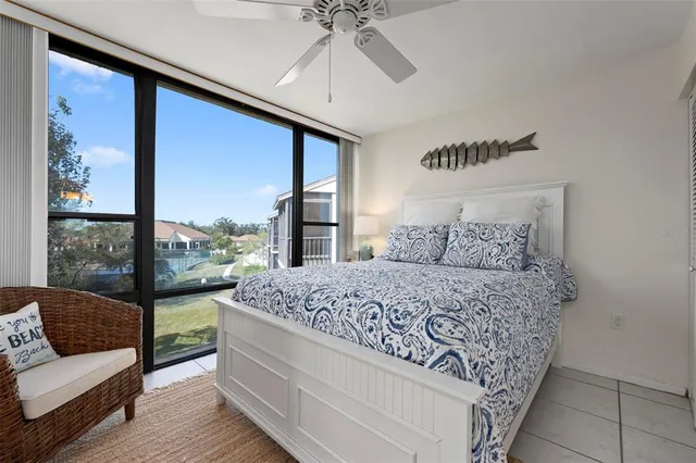 a bedroom with a large bed and a couch