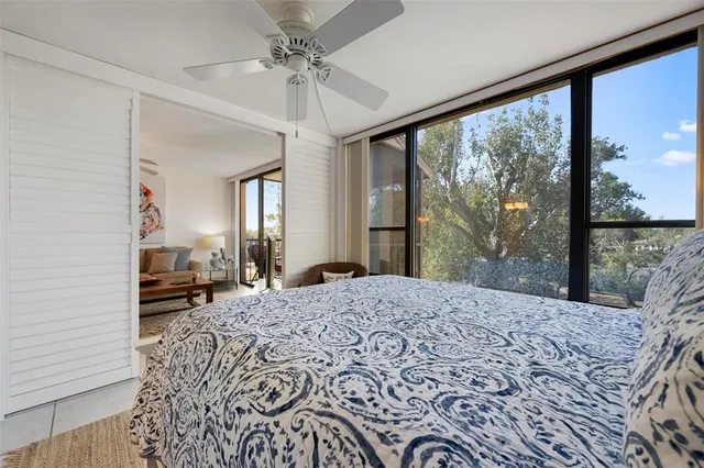 a living room with a large bed and a large window