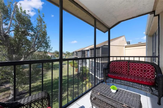 a view of balcony with wooden floor