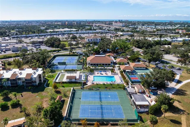 a view of a chairs and table in backyard