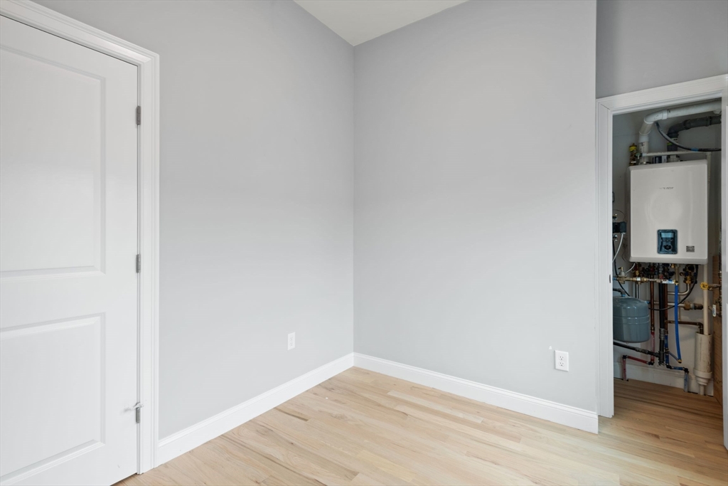 7 Waumbeck Street, Unit 2 Boston, MA 02121 - Photo 13 of 18 a view of a room with wooden floor and a sink