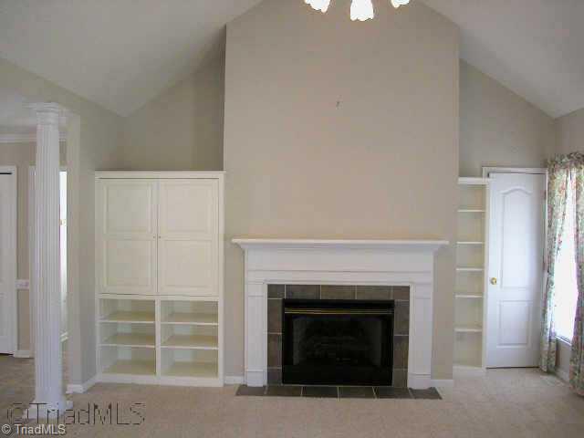 1040 Woodbury Road King, NC 27021 - Photo 4 of 9 Other. Great room w/gas log FP, cathedral ceiling, built-in shelves & TV shelf behind doors.