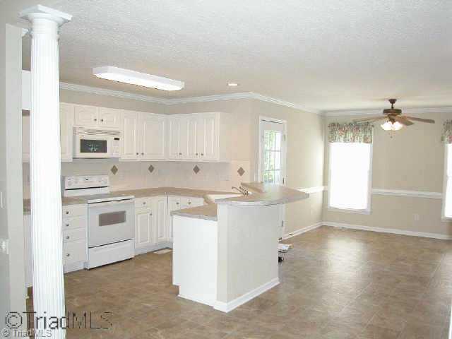 1040 Woodbury Road King, NC 27021 - Photo 5 of 9 Other. Open & airy with colums between LR & dining areas. Also, neutral colors!