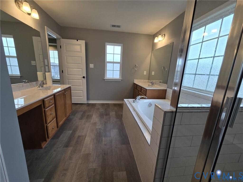 7825 Old Guild Road Richmond, VA 23237 - Photo 20 of 27 Bathroom featuring dual vanities with light counte
