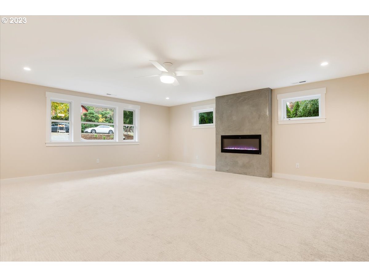29475 Southeast Wheeler Road Boring, OR 97009 - Photo 23 of 45 a big room with windows and a fireplace