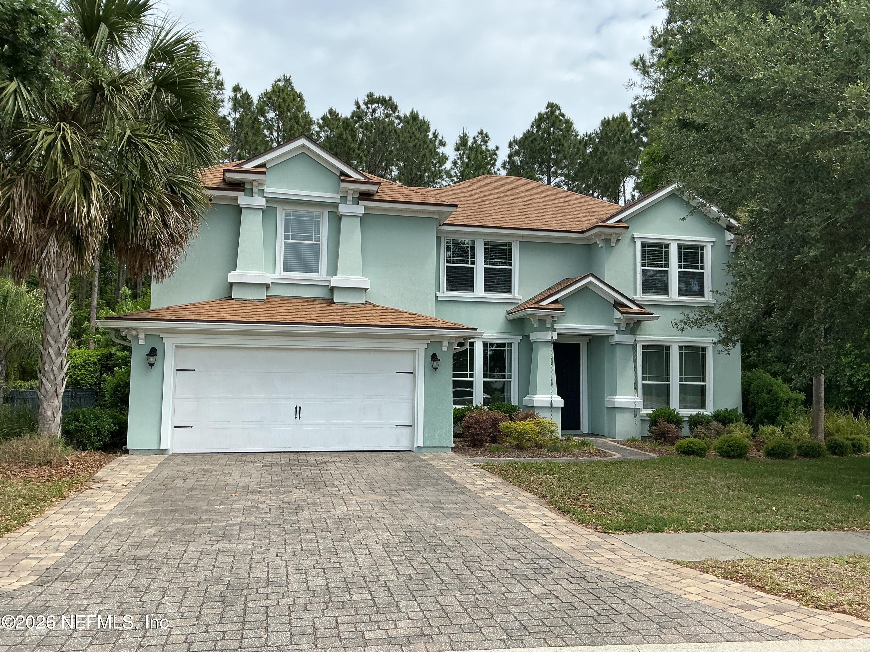 85667 Berryessa Way Fernandina Beach, FL 32034 - Photo 1 of 39 a front view of a house with a yard