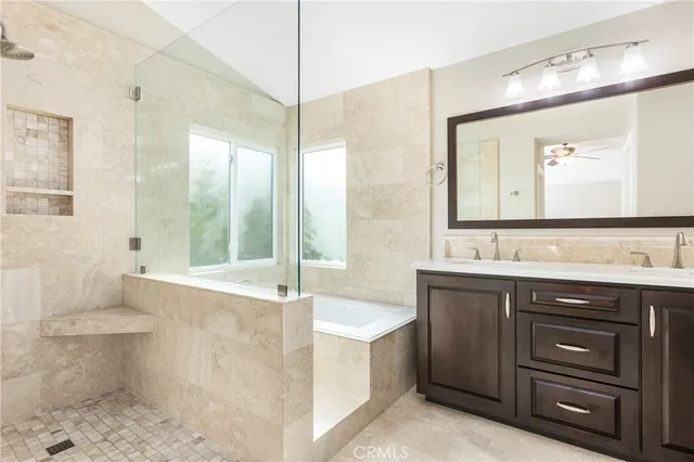 a spacious bathroom with a sink a toilet and a mirror