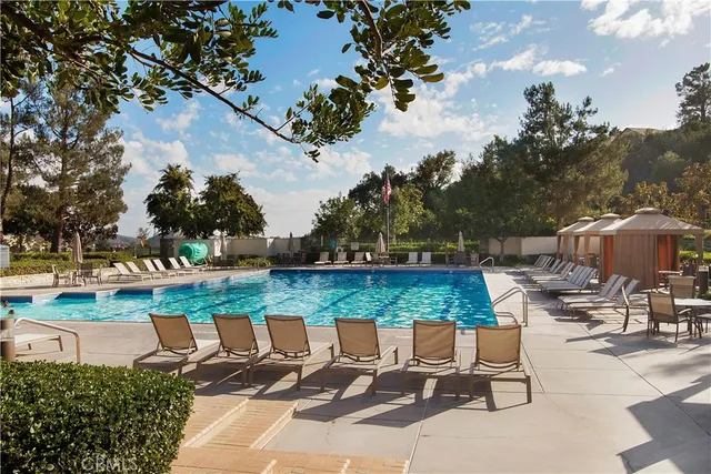 an outdoor space with patio and lake view