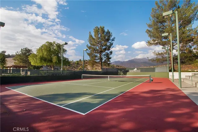 a view of an outdoor space and tennis court