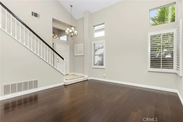 a view of an entryway with wooden floor
