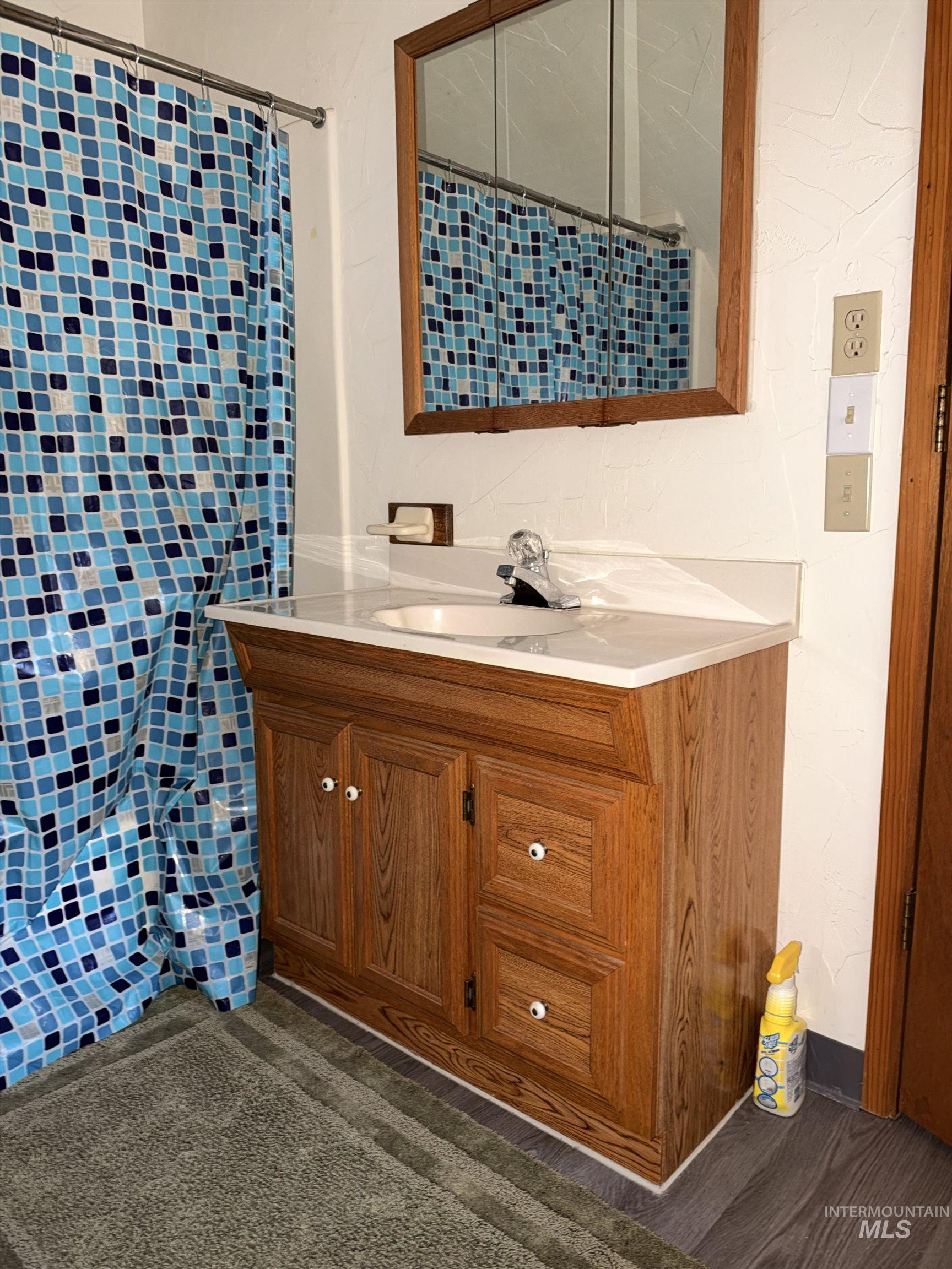 687 Big Cedar Road Kooskia, ID 83539 - Photo 29 of 37 Wood-finish vanity with an integrated sink and light-colored countertop