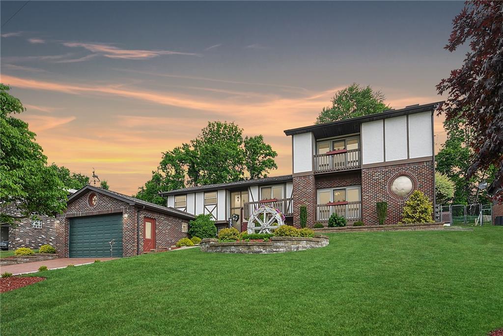 38 Manor Road Donora, PA 15033 - Photo 1 of 25 a front view of house with yard and outdoor seating