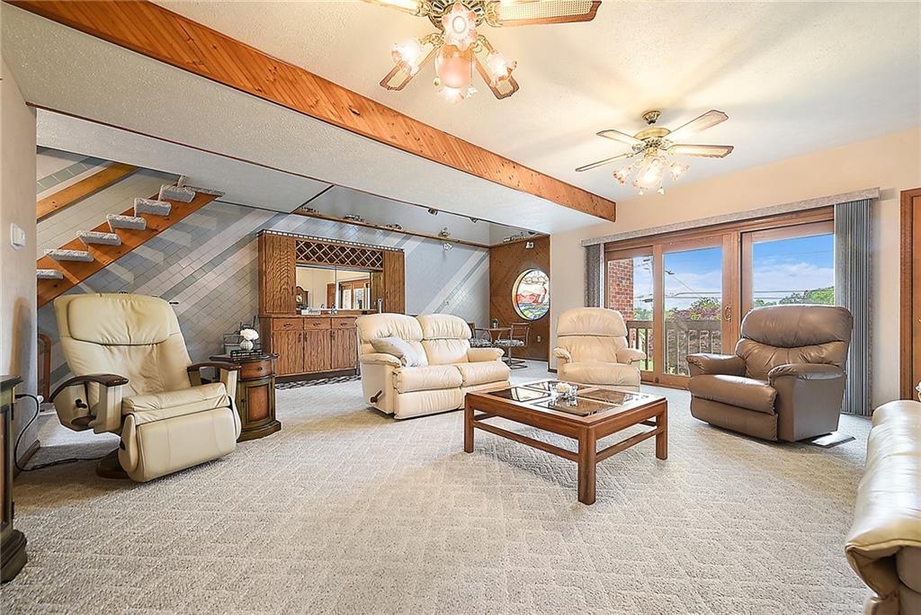 38 Manor Road Donora, PA 15033 - Photo 2 of 25 a living room with furniture and a chandelier
