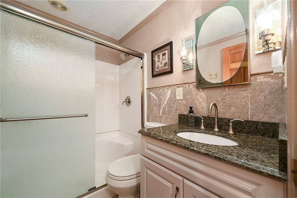 38 Manor Road Donora, PA 15033 - Photo 14 of 25 a bathroom with a sink and a mirror