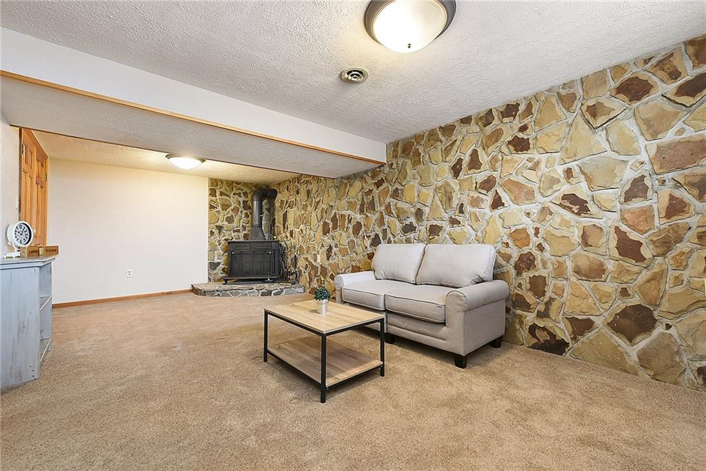 38 Manor Road Donora, PA 15033 - Photo 15 of 25 a living room with furniture and a chandelier