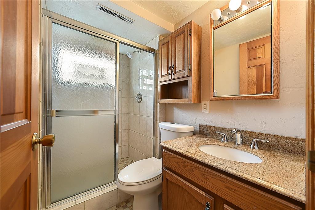 38 Manor Road Donora, PA 15033 - Photo 16 of 25 a bathroom with a granite countertop sink toilet and shower