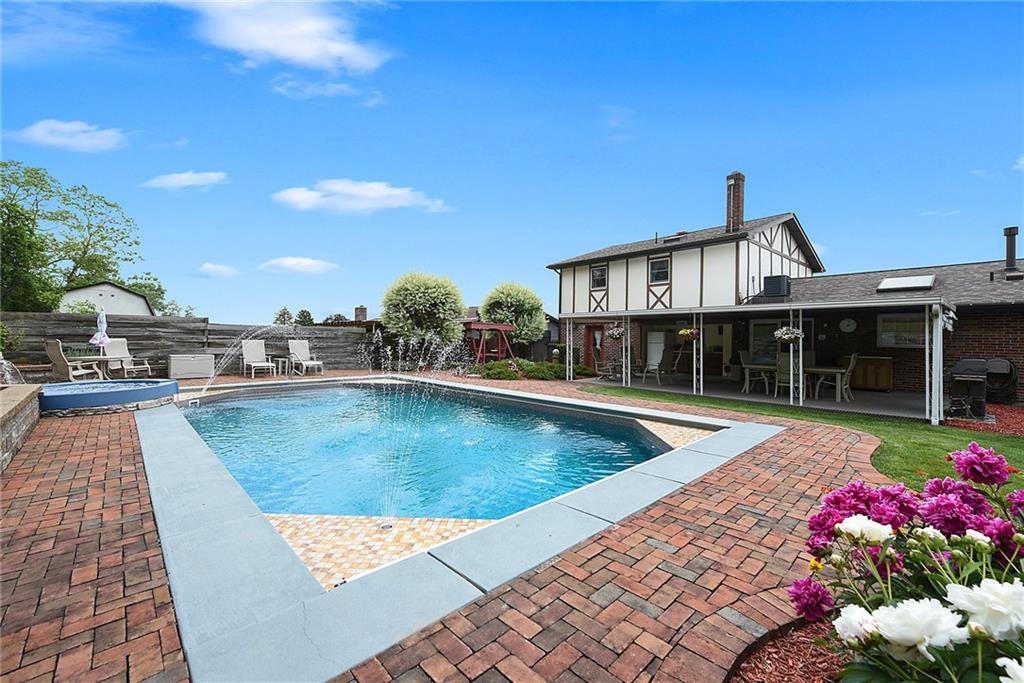 38 Manor Road Donora, PA 15033 - Photo 17 of 25 a view of a swimming pool with an outdoor seating