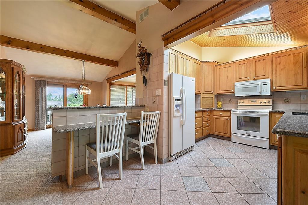 38 Manor Road Donora, PA 15033 - Photo 4 of 25 a kitchen with granite countertop a sink appliances and cabinets