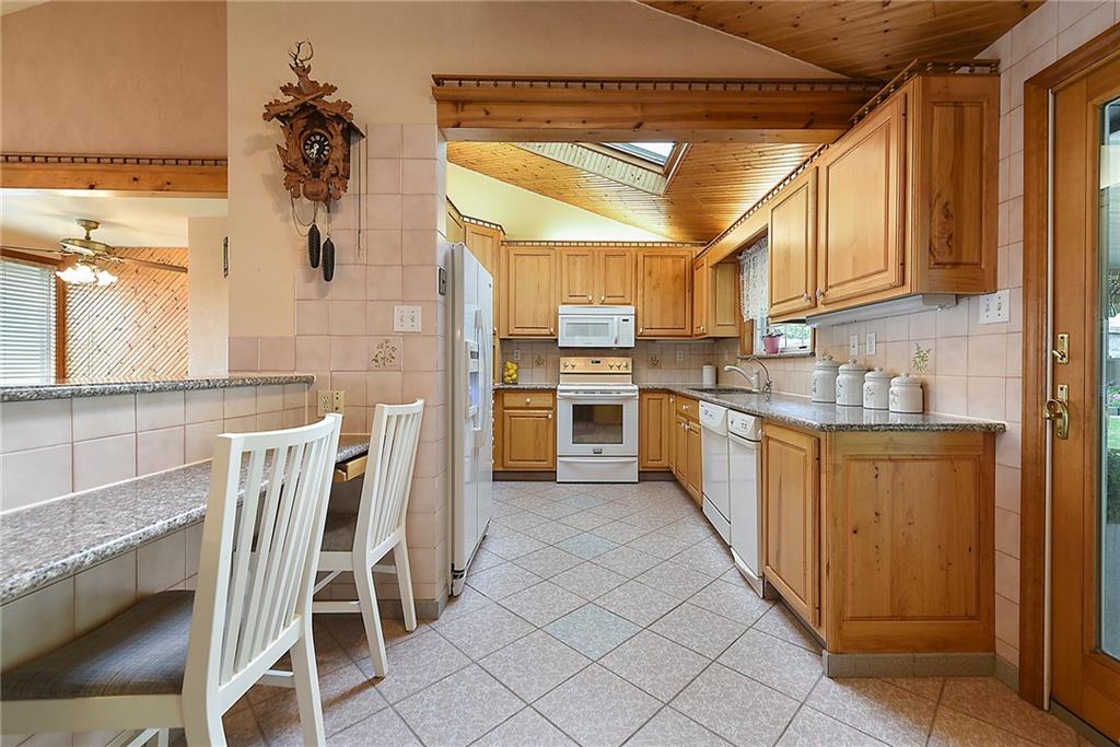 38 Manor Road Donora, PA 15033 - Photo 5 of 25 a kitchen with stainless steel appliances granite countertop a sink and a refrigerator