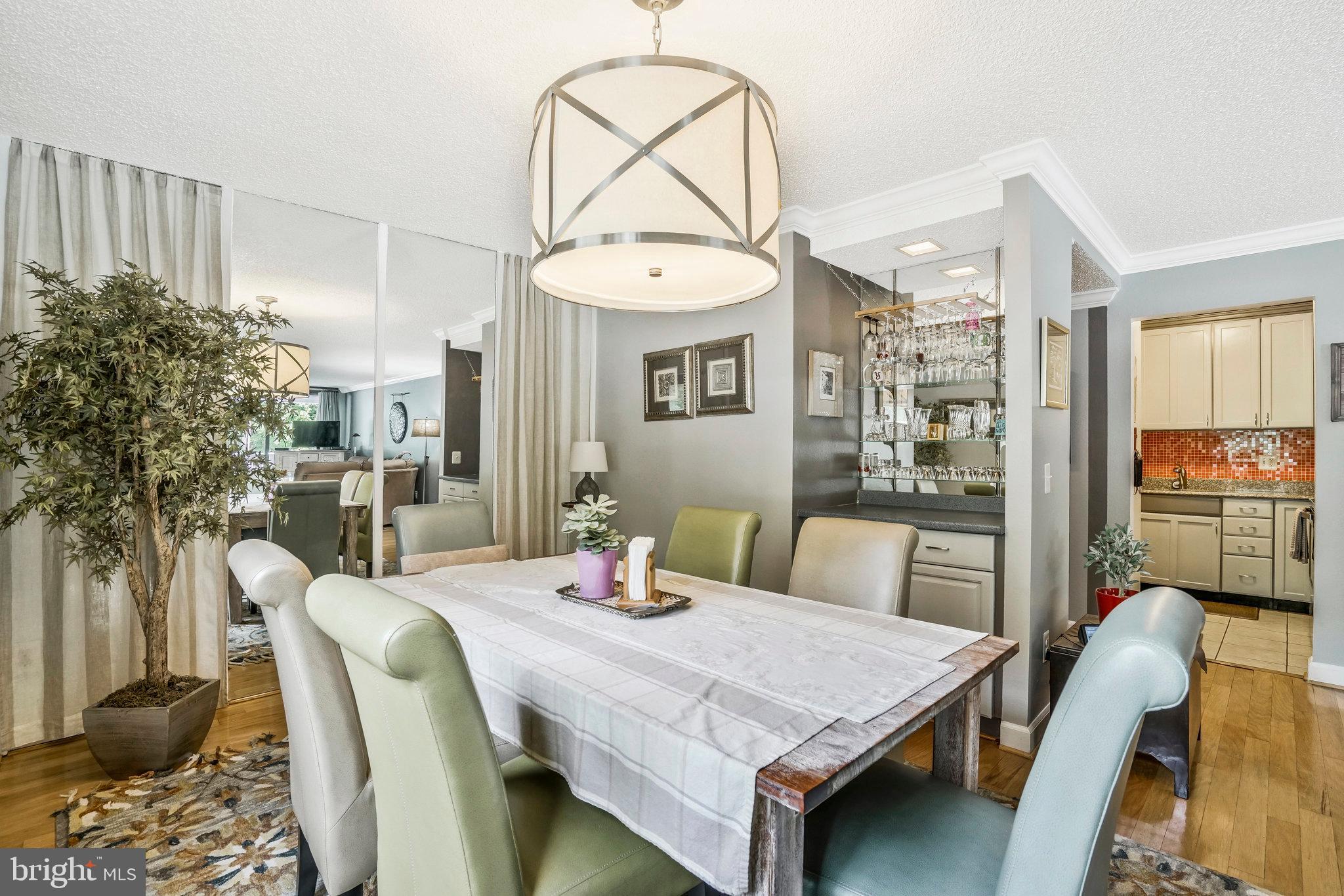 6101 Edsall Road, Unit 302 Alexandria, VA 22304 - Photo 11 of 59 a view of a dining room with furniture