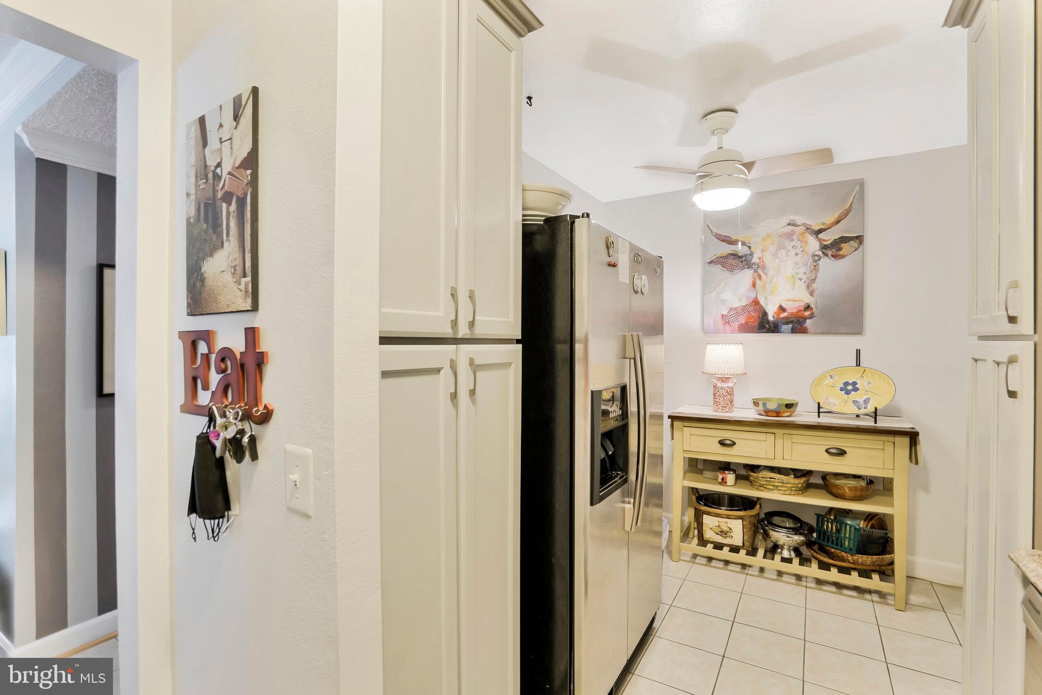 6101 Edsall Road, Unit 302 Alexandria, VA 22304 - Photo 14 of 59 a kitchen with stainless steel appliances a refrigerator and a stove top oven