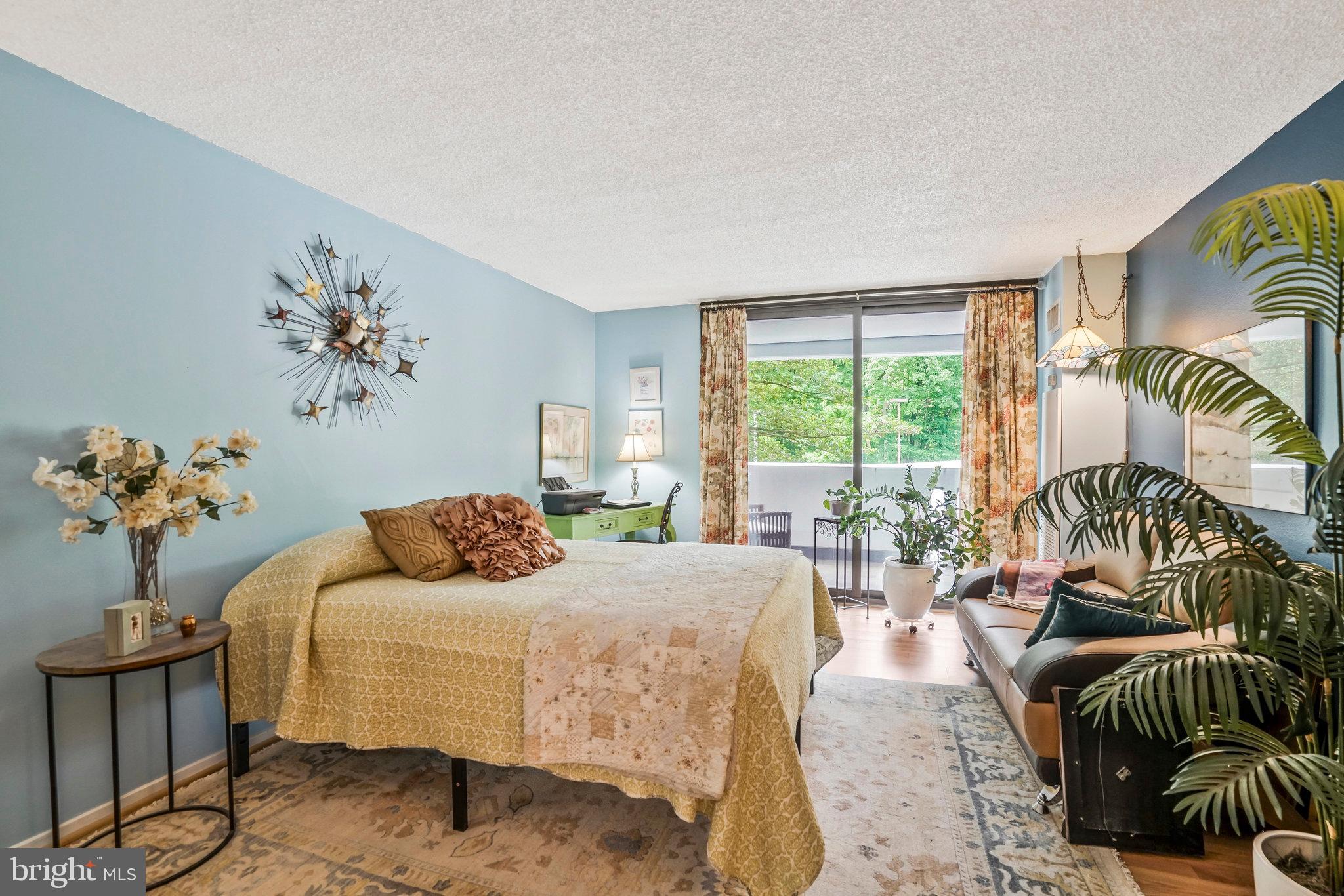 6101 Edsall Road, Unit 302 Alexandria, VA 22304 - Photo 19 of 59 a bedroom with furniture and a large window