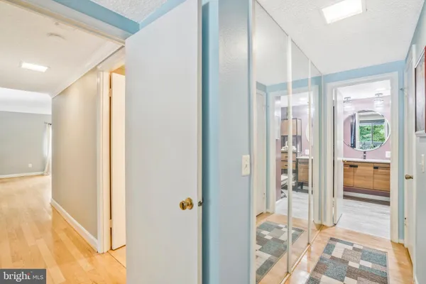 a bathroom with a sink mirror and vanity