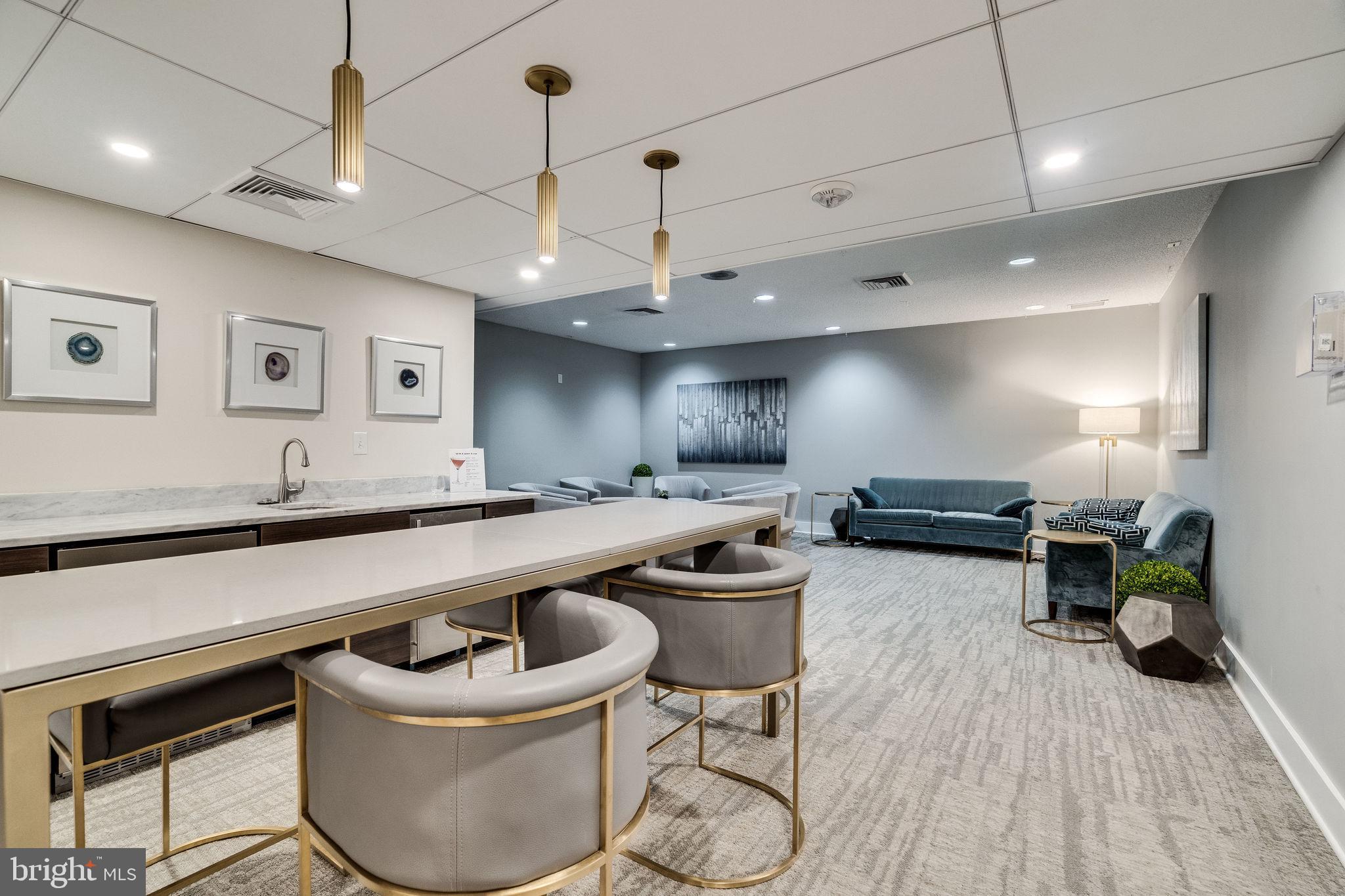 6101 Edsall Road, Unit 302 Alexandria, VA 22304 - Photo 47 of 59 a large kitchen with a table and chairs in it