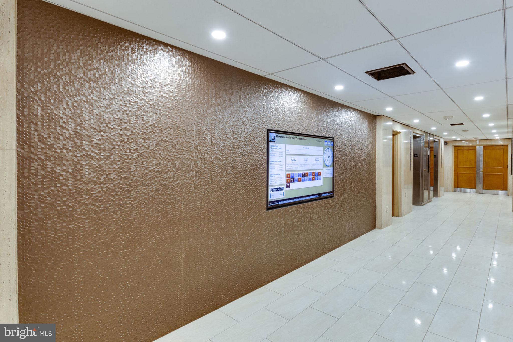 6101 Edsall Road, Unit 302 Alexandria, VA 22304 - Photo 52 of 59 a view of a hallway with a large mirror