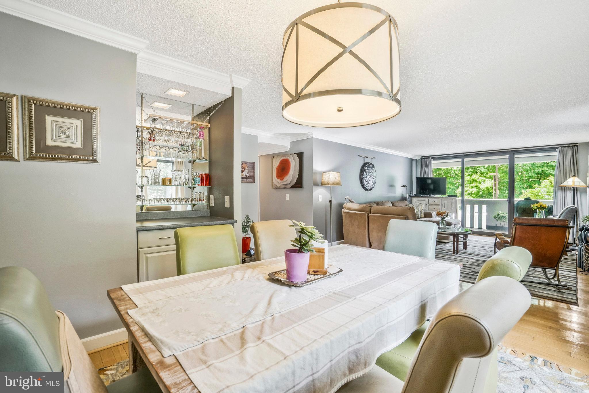 6101 Edsall Road, Unit 302 Alexandria, VA 22304 - Photo 9 of 59 a kitchen with a table and chairs