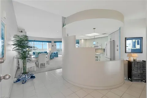a kitchen with white cabinets stainless steel appliances and a sink