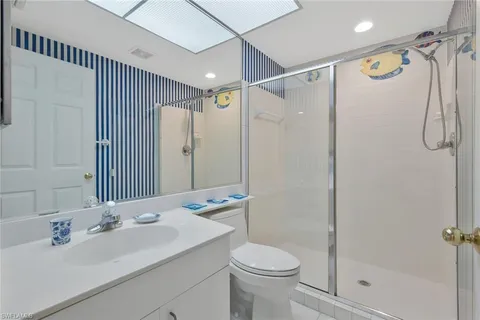 a living room with furniture and painting on the wall