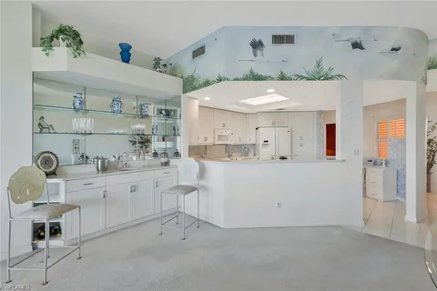 a view of livingroom with furniture and a potted plant