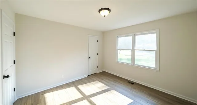 a bathroom with a sink vanity and mirror