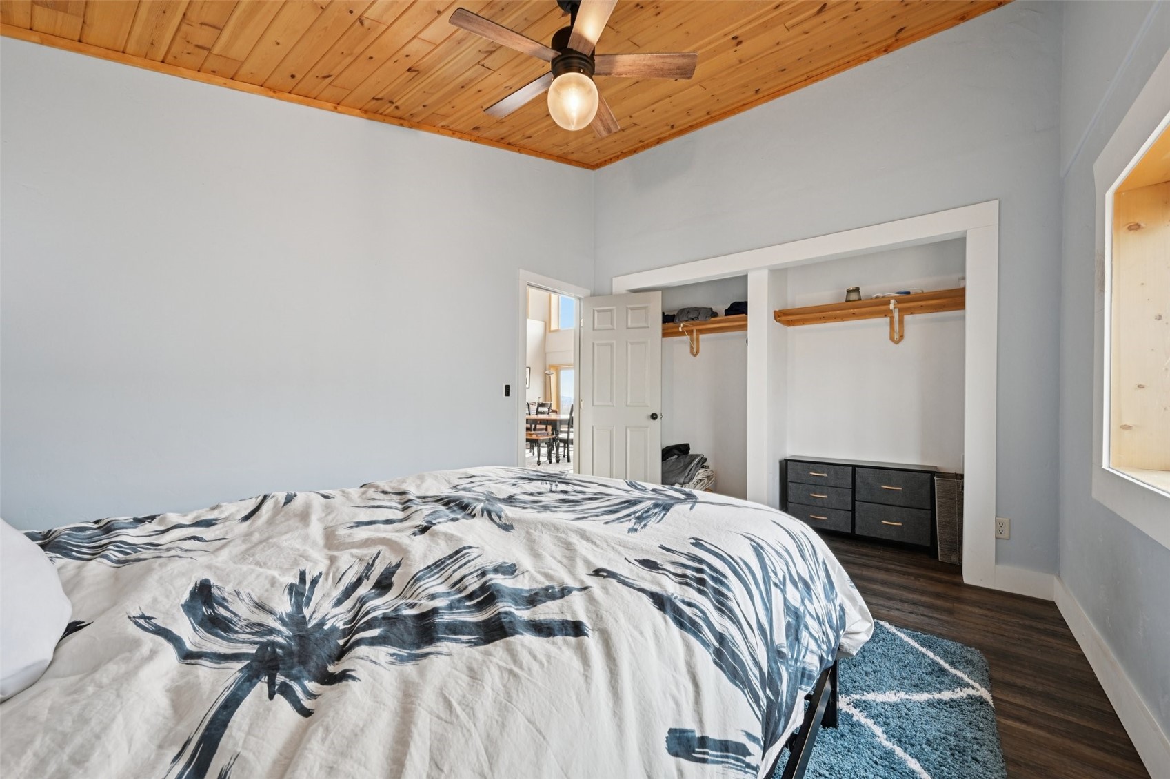 1499 Sheep Ridge Road Fairplay, CO 80440 - Photo 20 of 40 a bedroom with a bed and a chandelier