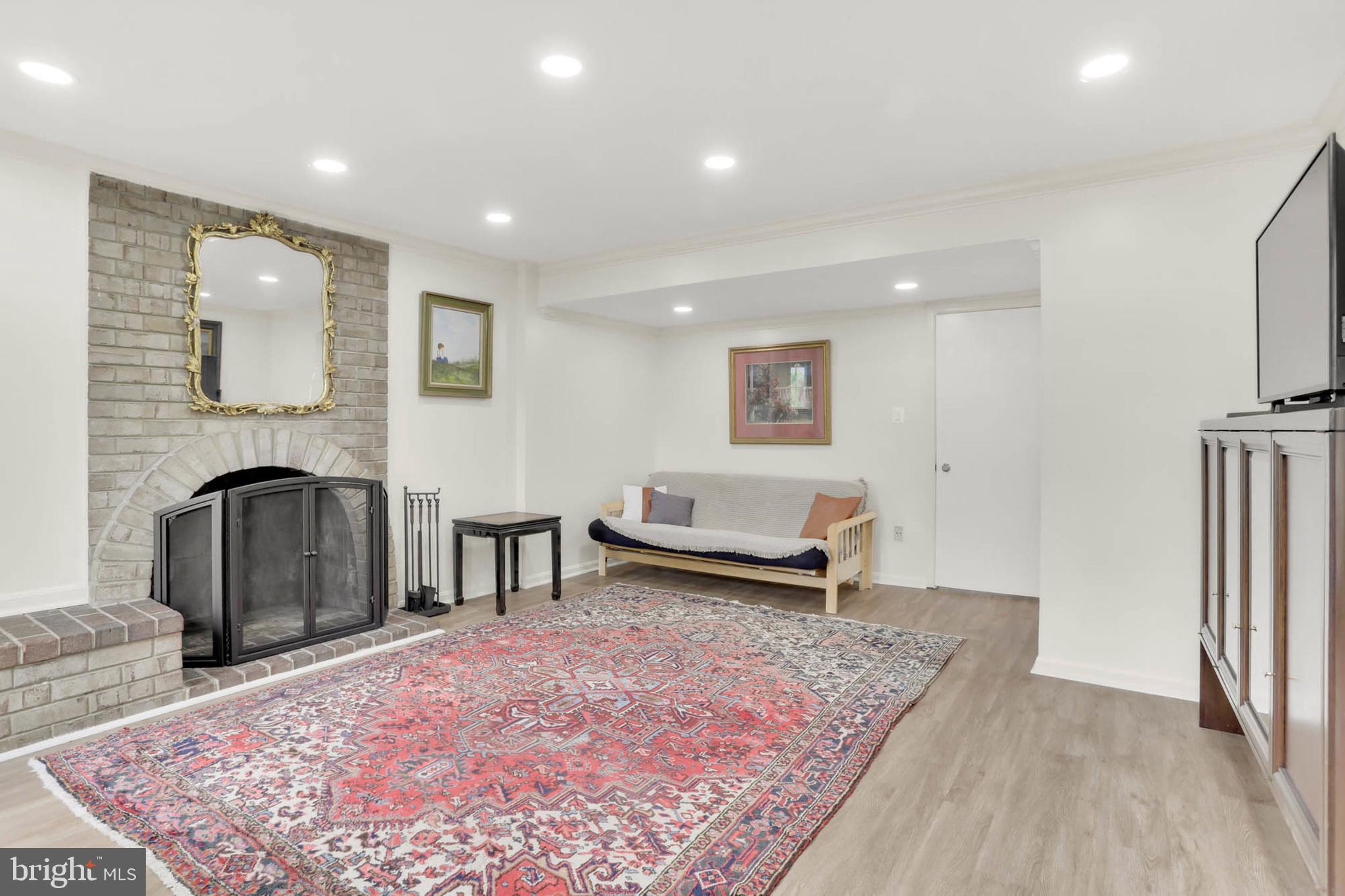 12608 Garden Gate Road Silver Spring, MD 20902 - Photo 24 of 40 2nd level Family Room w/ wood burning fireplace