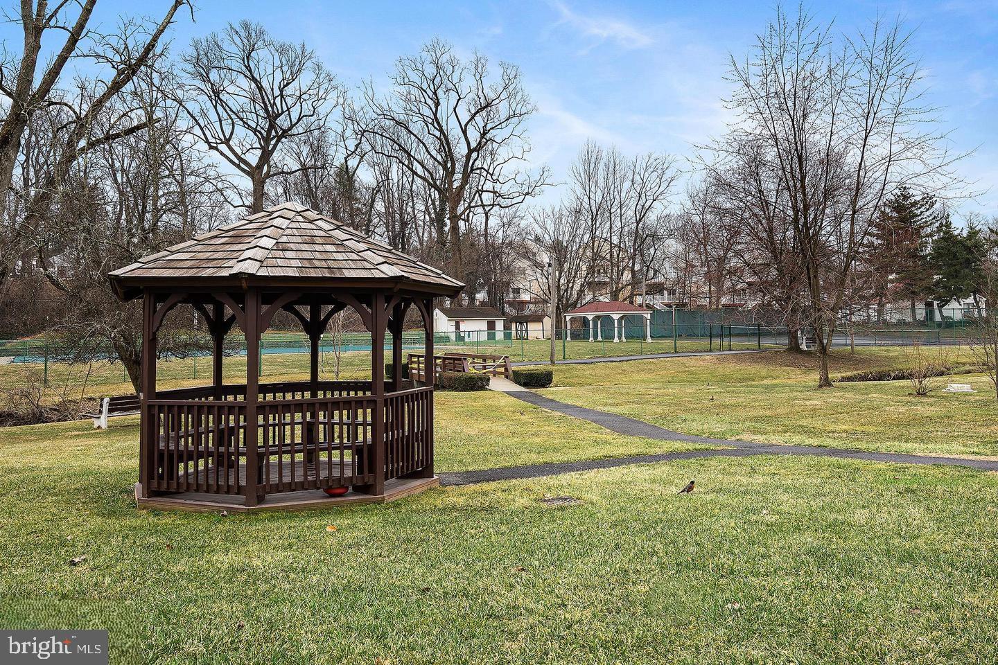 301-00 Byberry Road, Unit F4 Philadelphia, PA 19116 - Photo 11 of 14 a view of a swimming pool with a yard