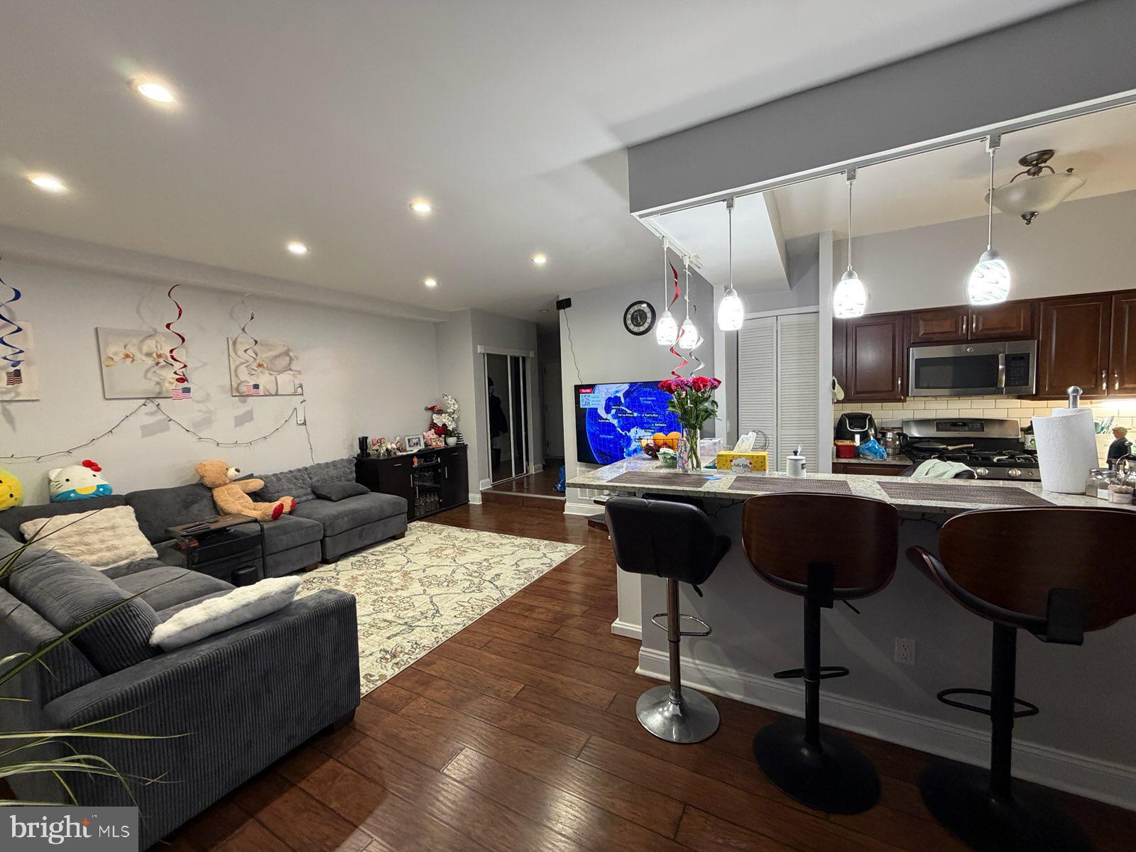 301-00 Byberry Road, Unit F4 Philadelphia, PA 19116 - Photo 3 of 14 a living room with furniture and kitchen view