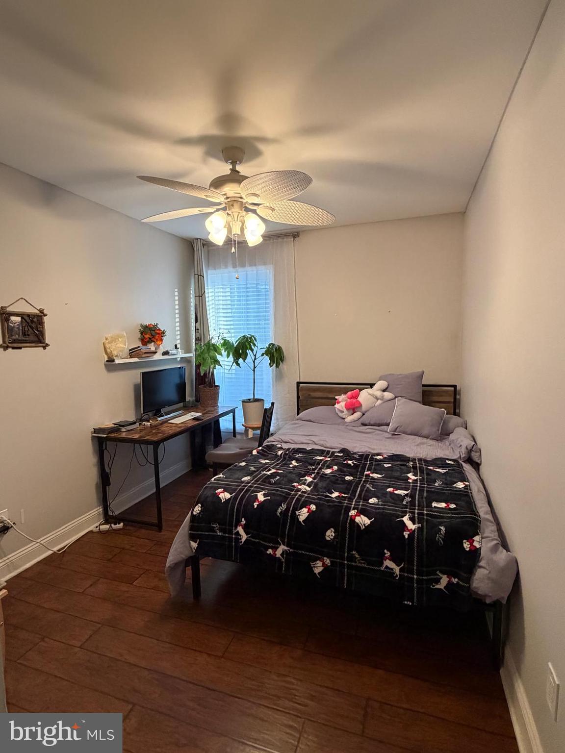 301-00 Byberry Road, Unit F4 Philadelphia, PA 19116 - Photo 9 of 14 a bedroom with a bed and a chandelier