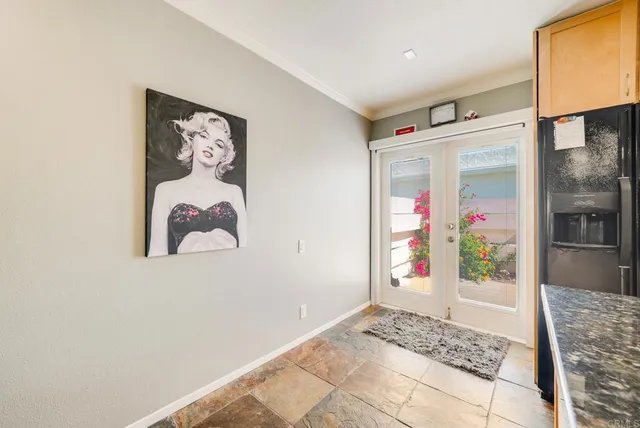 a kitchen with stainless steel appliances granite countertop a refrigerator and a stove