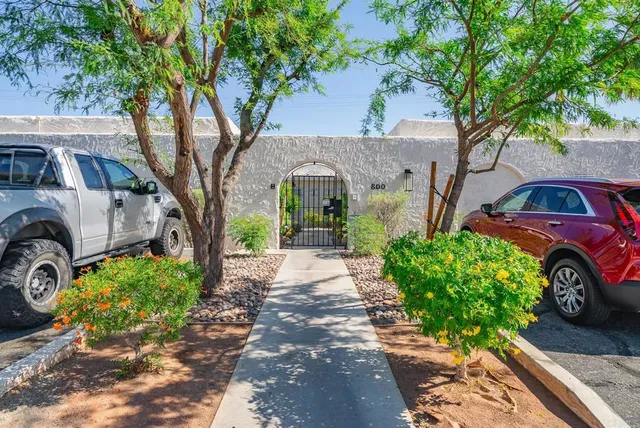 a front view of a building with sitting area