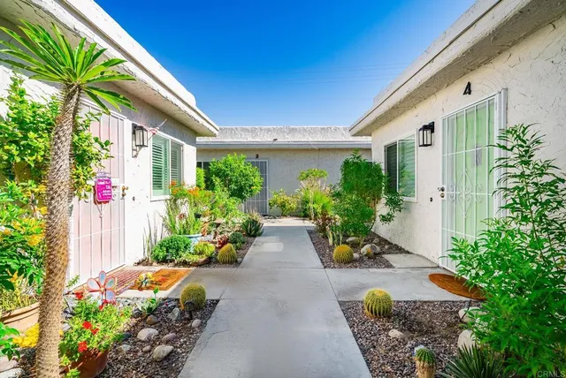 a view of a chairs and table in the patio