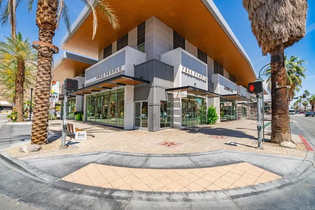a view of a lush green hillside and houses