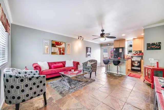 a bedroom with furniture and a window
