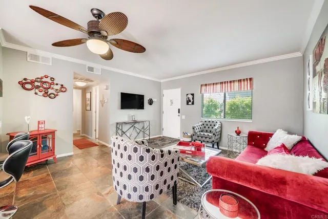 a kitchen with stainless steel appliances granite countertop a stove a refrigerator a sink dishwasher and a dining table with wooden cabinet