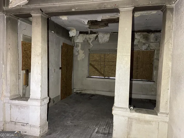 a view of a livingroom with a fireplace and cabinet